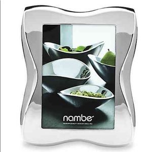 Frame of silver plate and glass. 5" x 7"